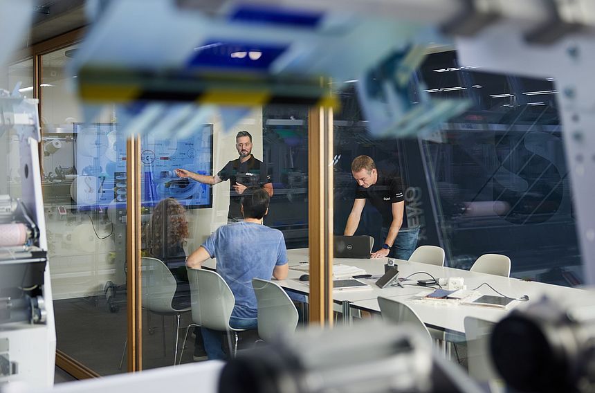  SSM textile experts conducting a customer training session at SSM Schärer Schweiter Mettler AG in Switzerland.