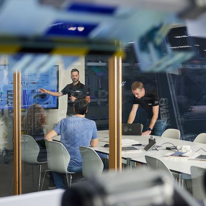  SSM textile experts conducting a customer training session at SSM Schärer Schweiter Mettler AG in Switzerland.