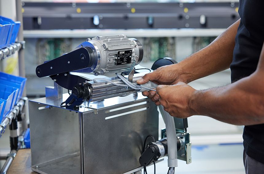 Technician preparing a motor for assembly on SSM winding machines