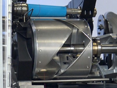 The automatic slit-drum opener, a unique feature of the Thread King III
